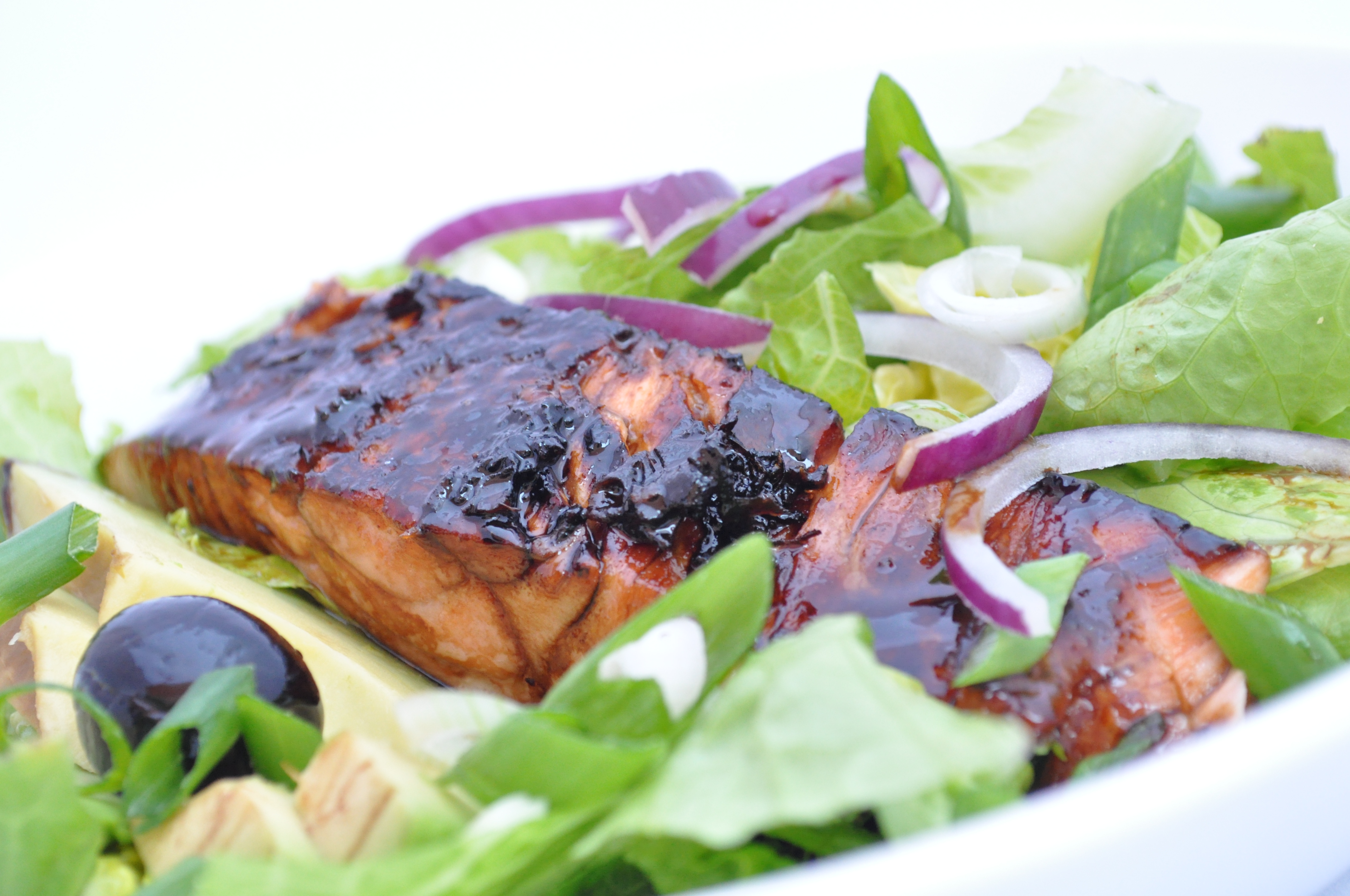 Salmon in mirin sauce on a salad