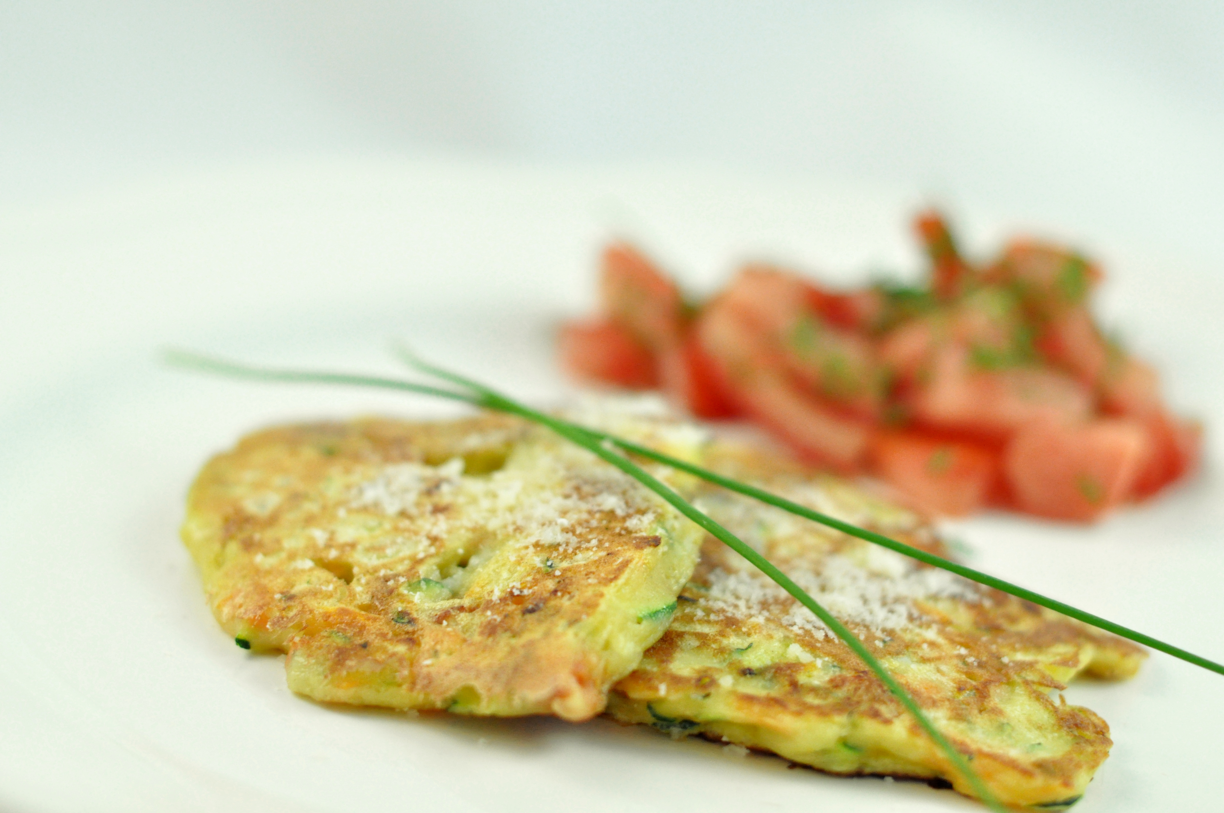 Zucchini and carrot fritters with chorizo and Parmesan
