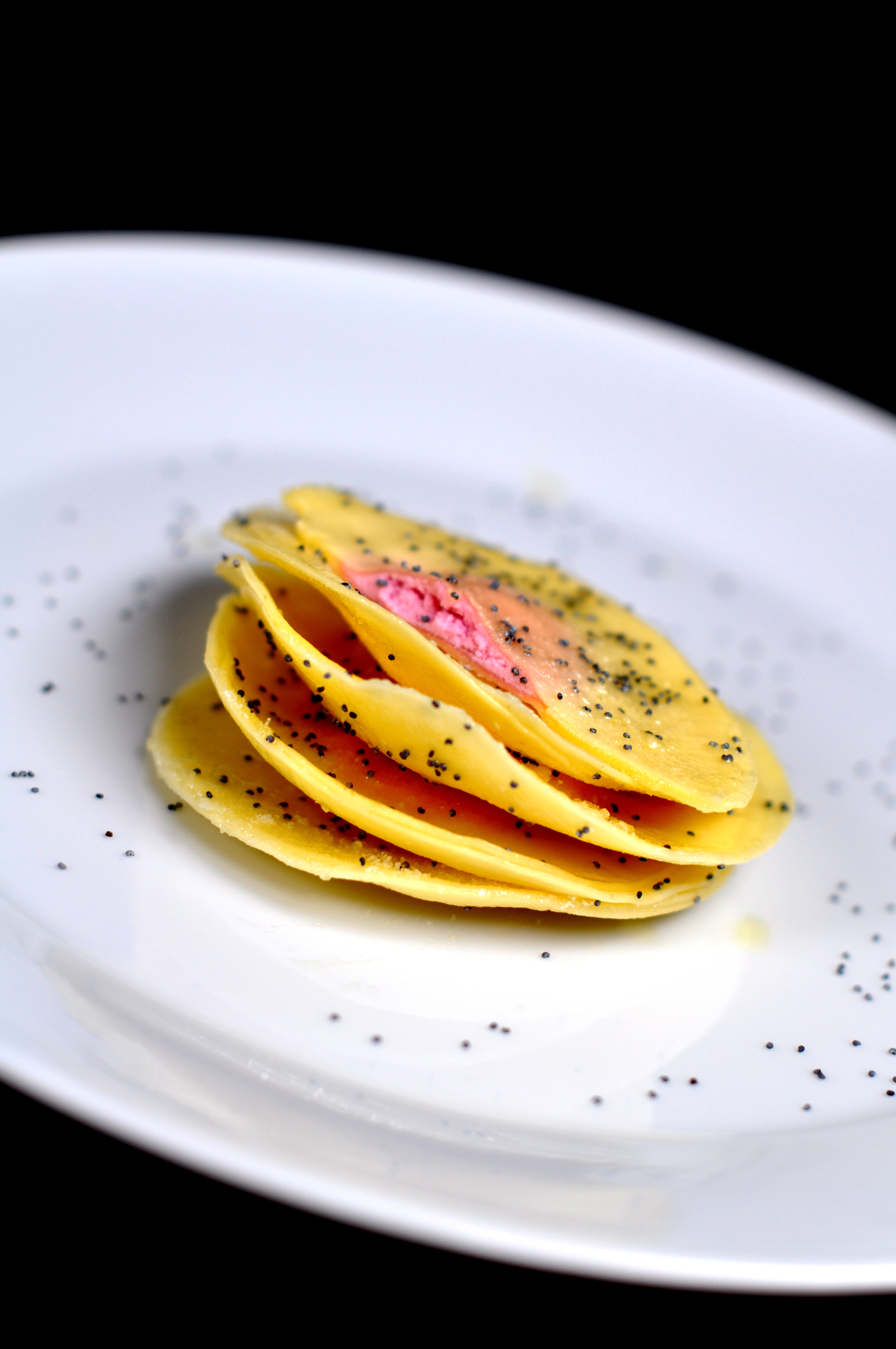 Ravioli with ricotta, beets and poppy seed butter