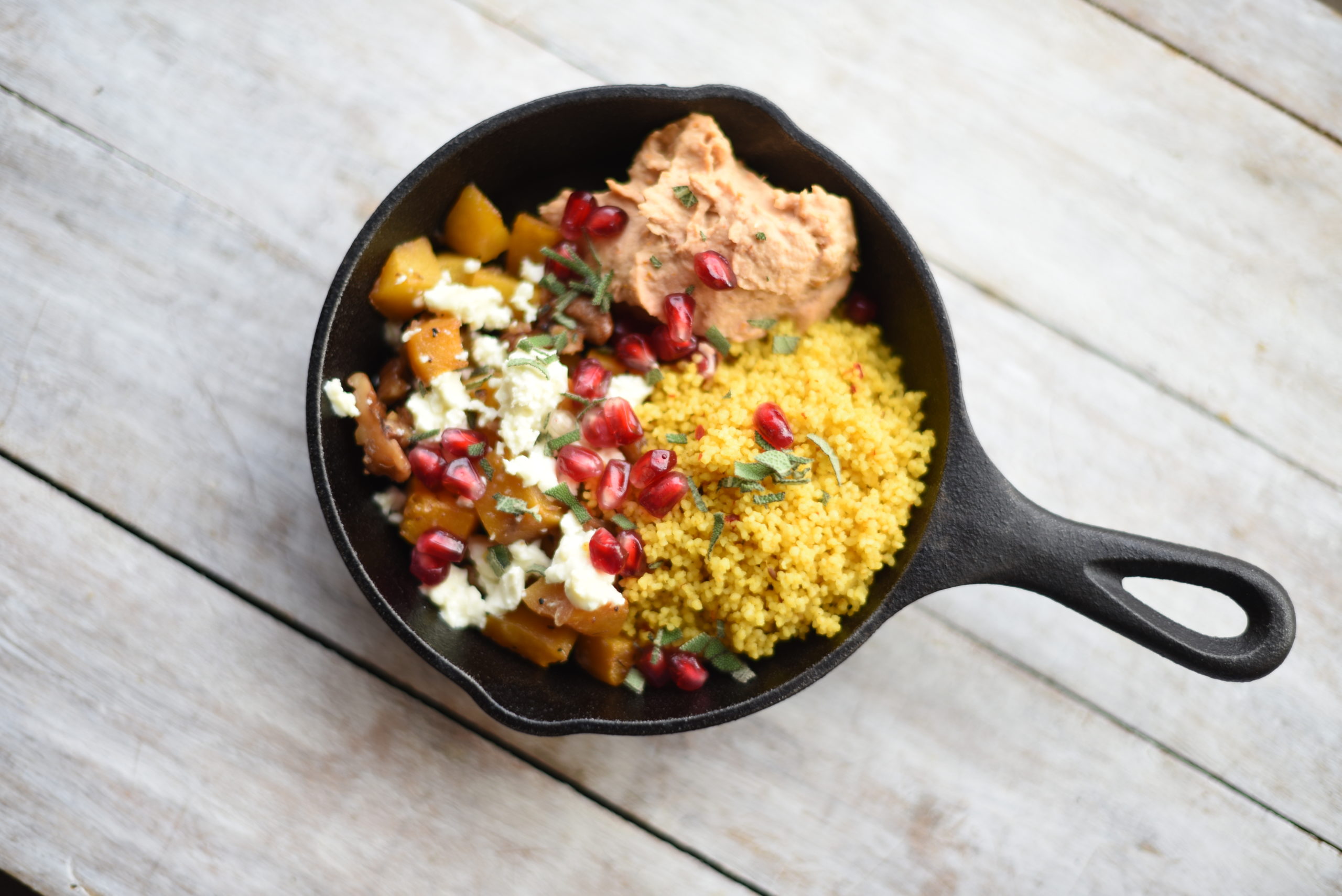 Roasted butternut squash with aromatic couscous and white bean hummus